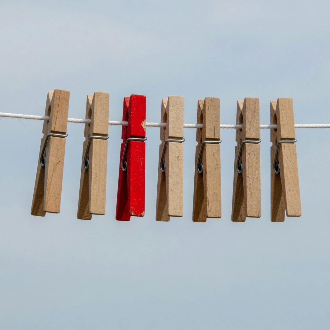 Clothespins on a line, by Grok Imagine